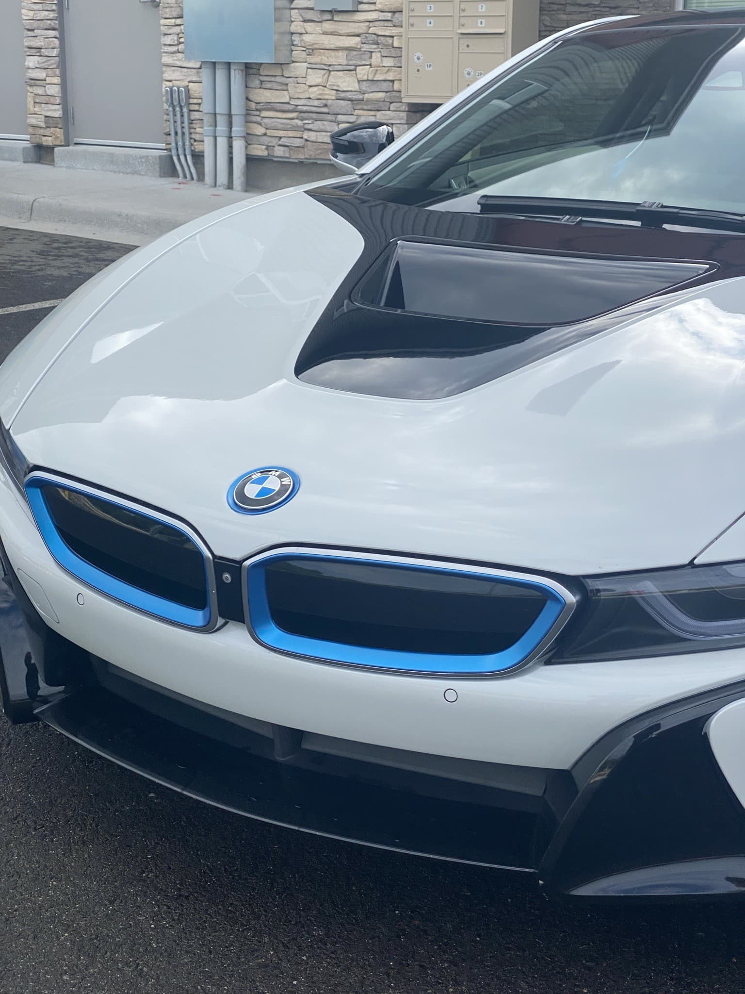 BMW i8 staged at a stone-clad Fairfield County residence for a wedding pickup